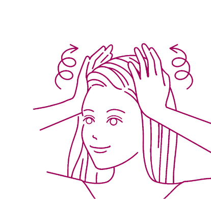 頭皮マッサージの方法① 手のひらを使い、こめかみから頭頂部に向かって、グルグルと円を描くようにやさしく押しほぐしていく。